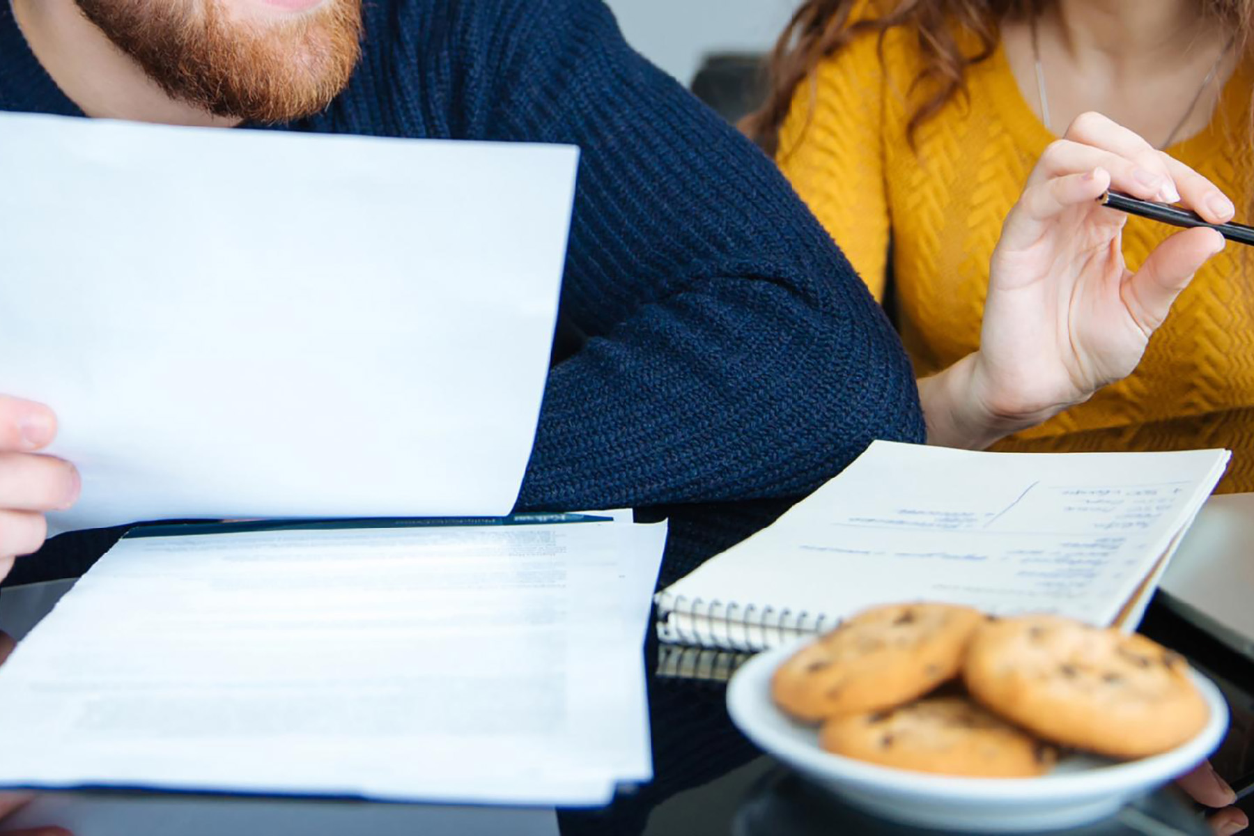 Two people looking over paperwork